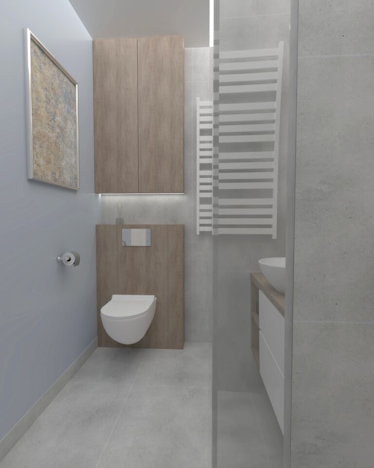 Szafką wiszącą za misą WC w łazience w małym mieszkaniu